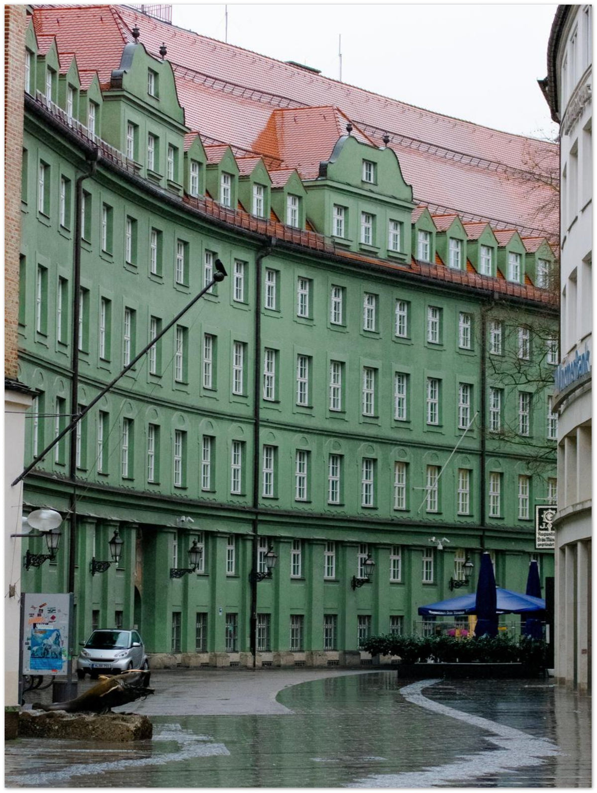 Curved Munich Building, shown at an angle to give a sense of depth and scale